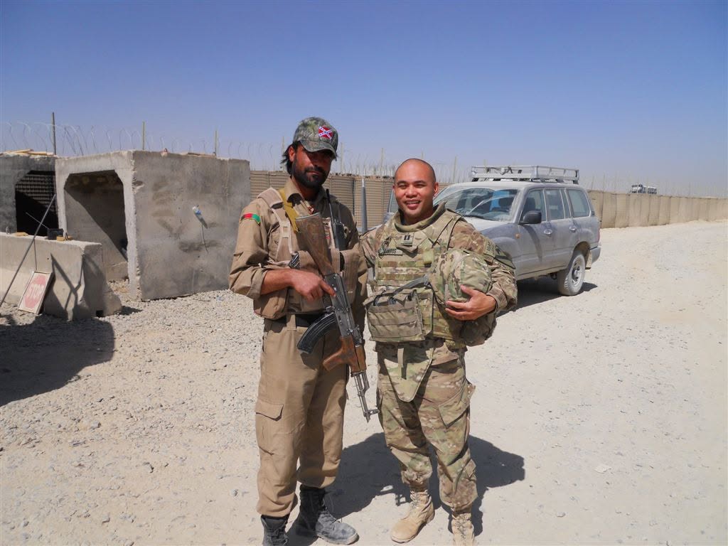 Peter J. Santos with an Afghan National Police officer at a base in Afghanistan